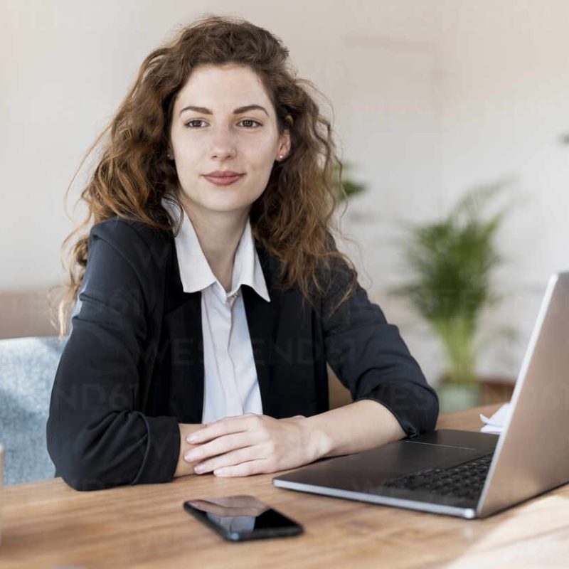 Portrait of beautiful woman in working sittuation at laptop in home office